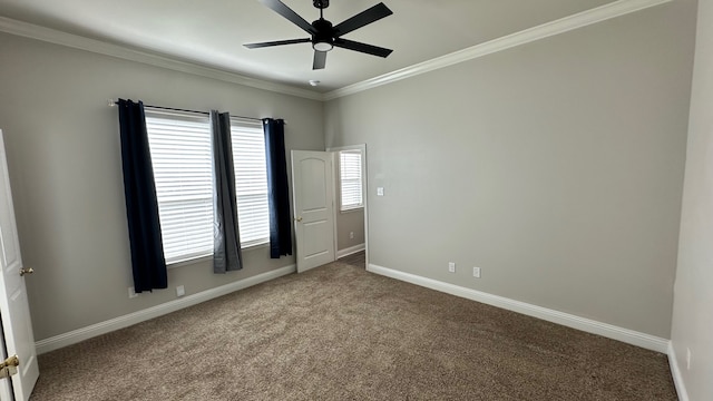 carpeted empty room with crown molding and ceiling fan