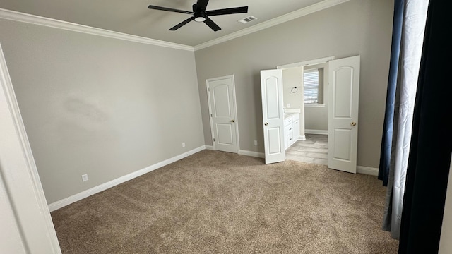 unfurnished bedroom featuring ceiling fan, light colored carpet, and ornamental molding