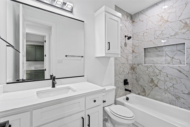 full bathroom with vanity, toilet, and tiled shower / bath