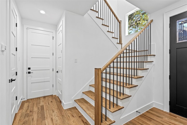 stairway featuring hardwood / wood-style flooring