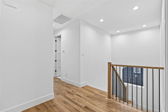 hall with light hardwood / wood-style floors