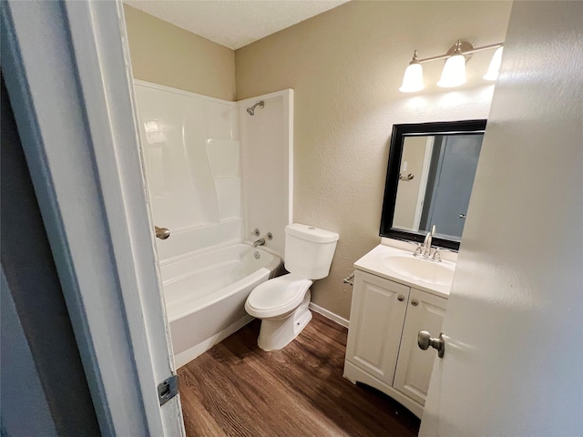 full bathroom featuring toilet, vanity, shower / bath combination, and hardwood / wood-style flooring