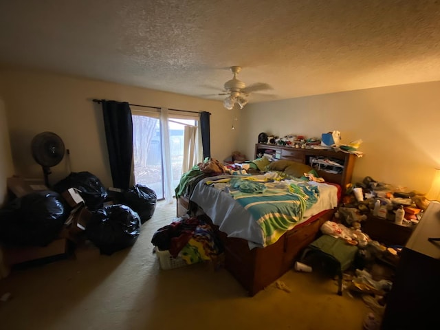 bedroom featuring access to exterior, a textured ceiling, ceiling fan, and carpet flooring