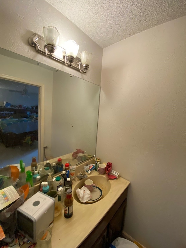 bathroom featuring vanity and a textured ceiling