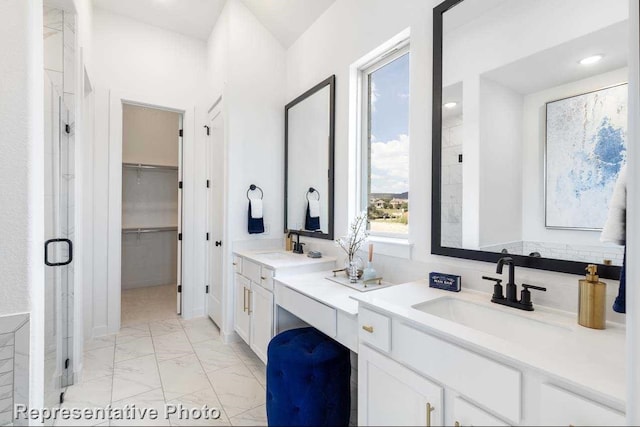 2166 Charming Forge Rd, Forney, TX 75126 - bathroom featuring marble look tiles, double vanity, a shower stall, and a spacious closet