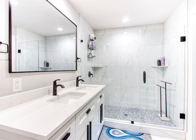 bathroom featuring vanity and a shower with shower door