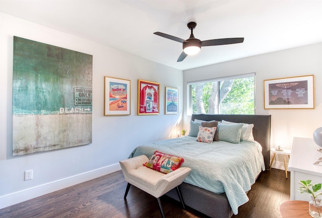 bedroom with ceiling fan and dark hardwood / wood-style flooring