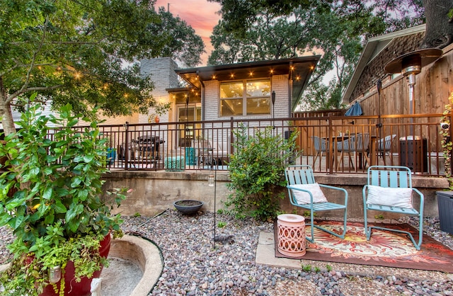 view of patio terrace at dusk