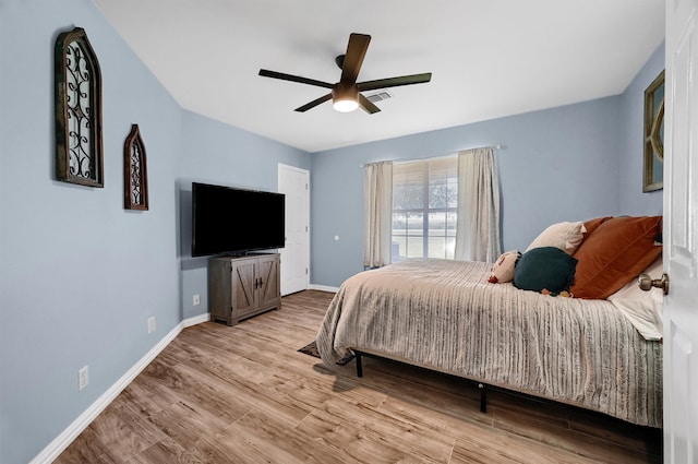 bedroom featuring ceiling fan and light hardwood / wood-style flooring