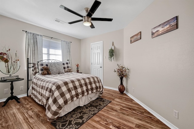 bedroom featuring hardwood / wood-style floors and ceiling fan