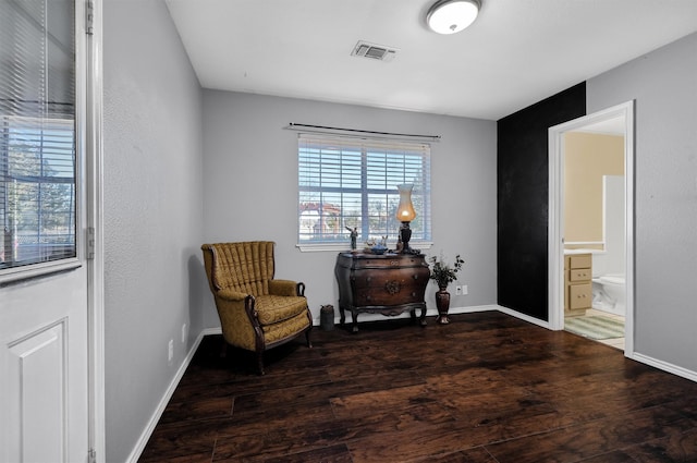 sitting room with dark hardwood / wood-style flooring