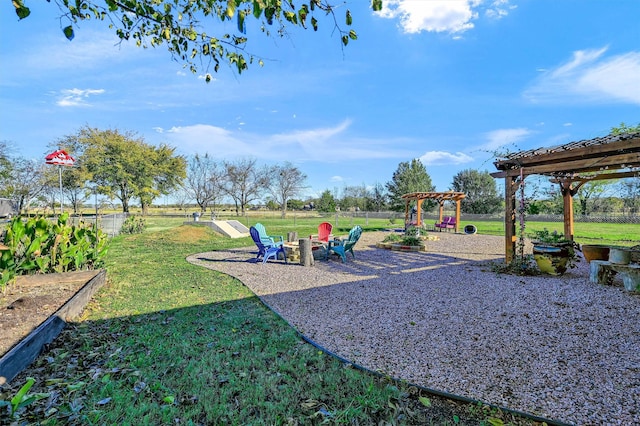 view of playground featuring a pergola and a yard