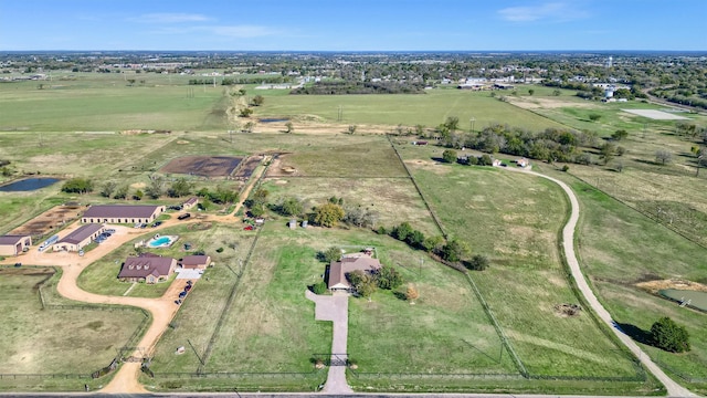 birds eye view of property featuring a rural view