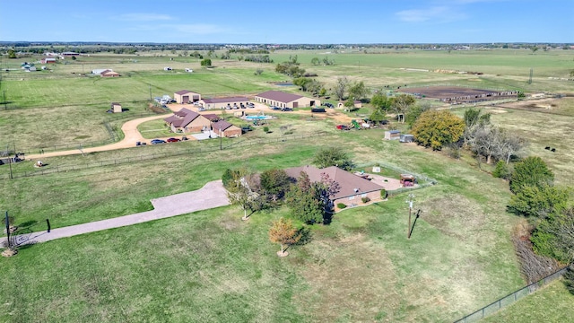 birds eye view of property with a rural view