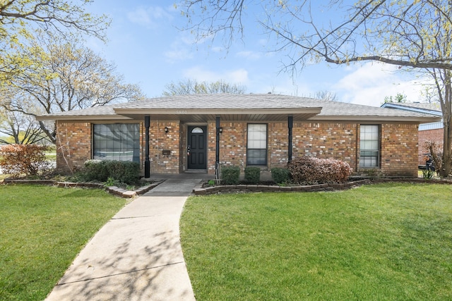 single story home featuring a front yard