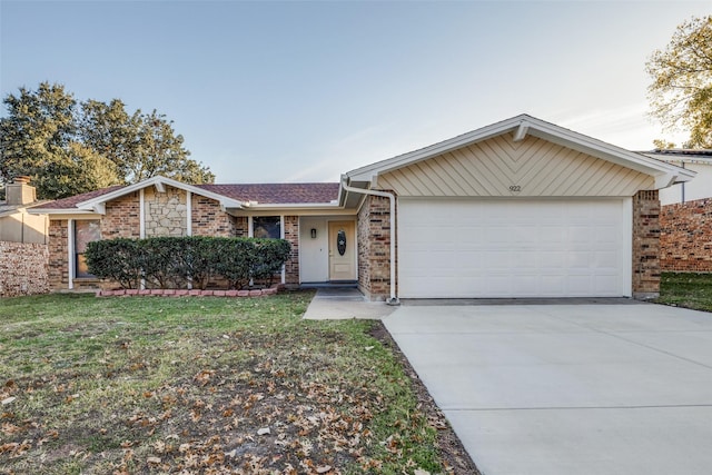 ranch-style home with a front yard and a garage