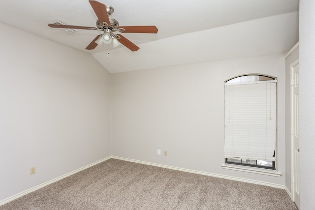 spare room with carpet, ceiling fan, and lofted ceiling