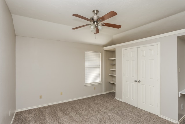 unfurnished bedroom with carpet floors, a closet, and ceiling fan