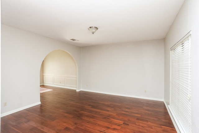 empty room featuring dark hardwood / wood-style floors