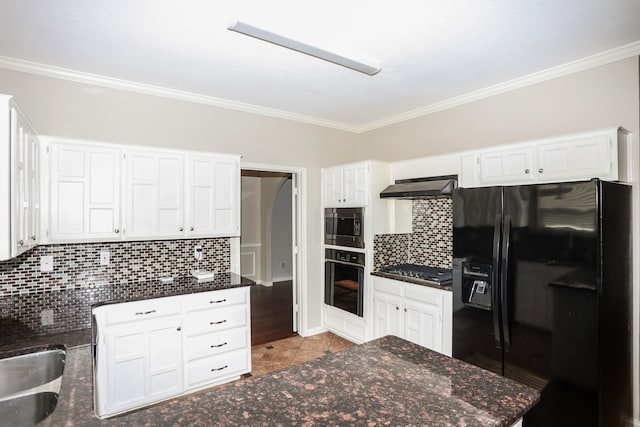 kitchen with exhaust hood, tasteful backsplash, white cabinetry, and black appliances