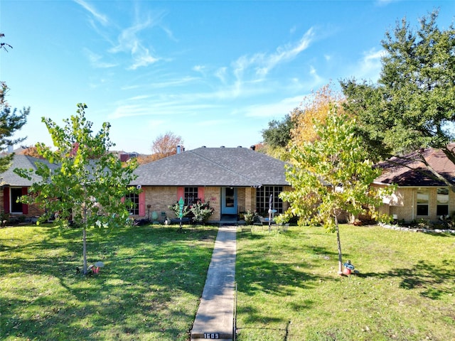 single story home with a front lawn