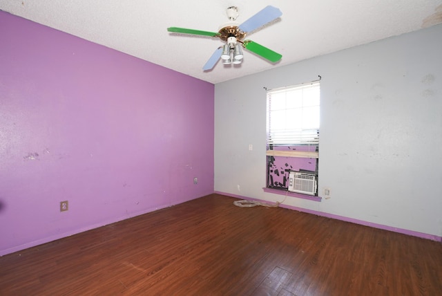 spare room with hardwood / wood-style flooring and ceiling fan