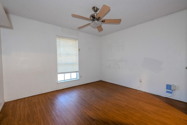 spare room featuring hardwood / wood-style flooring, plenty of natural light, and ceiling fan