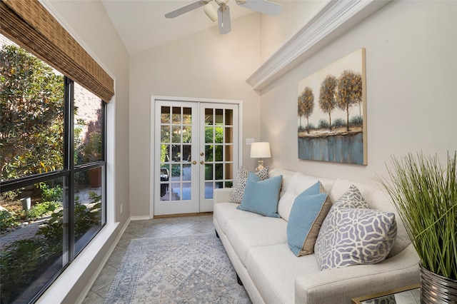 sunroom / solarium with ceiling fan, vaulted ceiling, and french doors