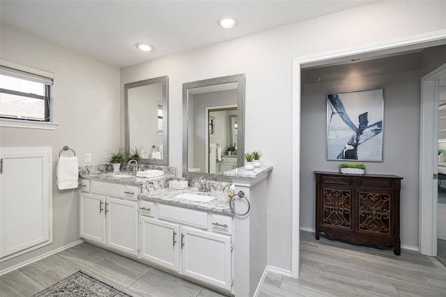 bathroom featuring hardwood / wood-style floors and vanity