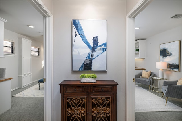 hallway featuring carpet floors