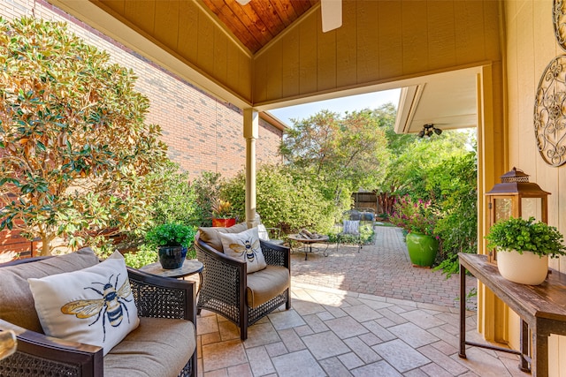 view of patio / terrace with ceiling fan and an outdoor living space