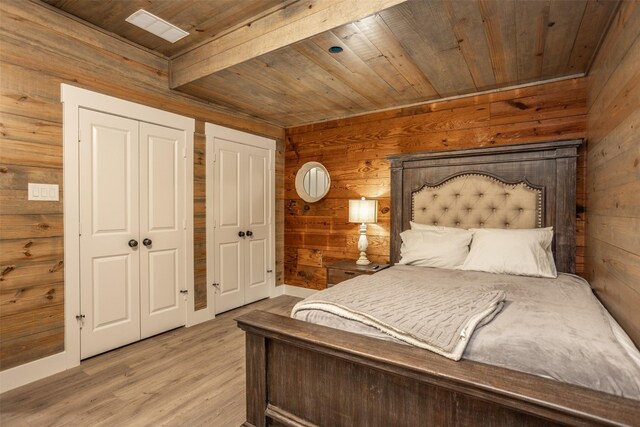 bathroom featuring vanity, wooden walls, and shower with separate bathtub