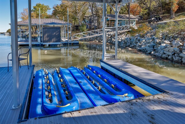 dock area with a water view