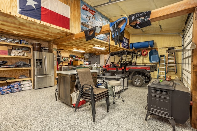 garage with stainless steel refrigerator with ice dispenser