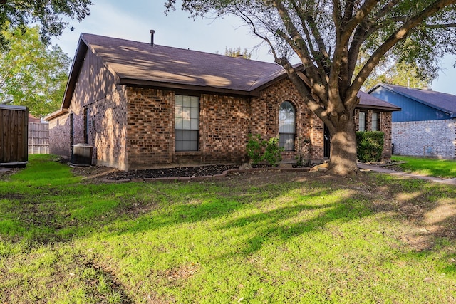 single story home with central AC unit and a front lawn