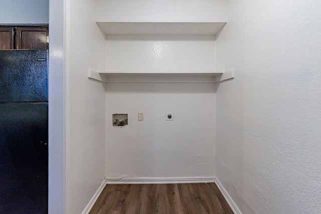 laundry area featuring electric dryer hookup, hookup for a washing machine, and dark hardwood / wood-style flooring