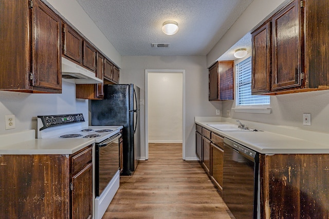 kitchen featuring sink, a textured ceiling, light wood-type flooring, dishwasher, and white range with electric cooktop