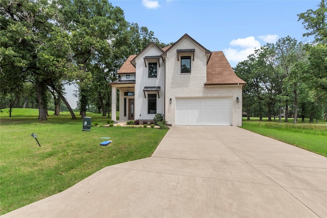 view of front of home featuring a garage and a front lawn