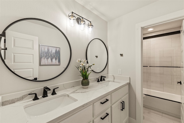 bathroom featuring vanity and bath / shower combo with glass door