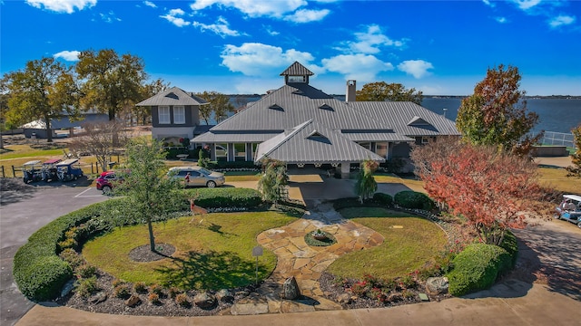 birds eye view of property with a water view