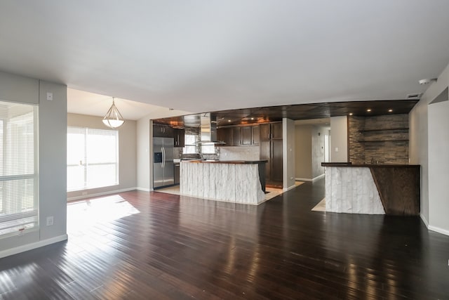 unfurnished living room featuring dark wood-type flooring