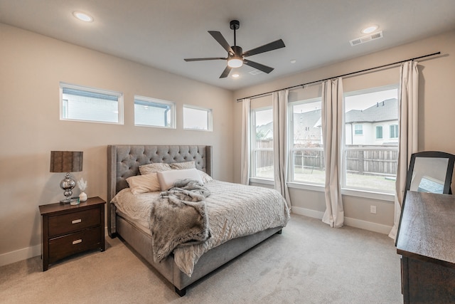 bedroom featuring ceiling fan and light colored carpet