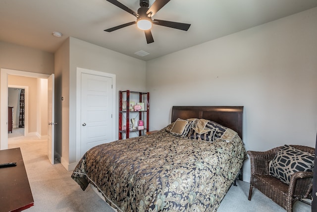 carpeted bedroom featuring ceiling fan