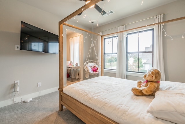 carpeted bedroom with ceiling fan