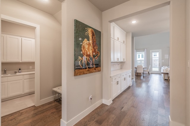 hall with dark hardwood / wood-style floors