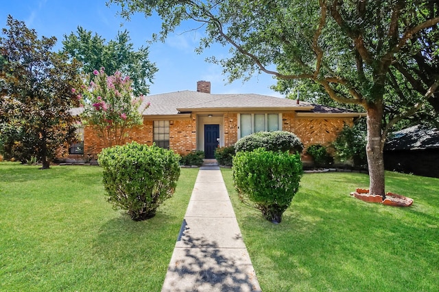 603 Lake Meadows Dr, Rockwall, TX 75087 - view of front of property with a front yard, a chimney, and brick siding