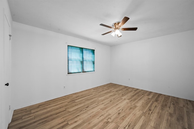 unfurnished room featuring light wood-type flooring and ceiling fan