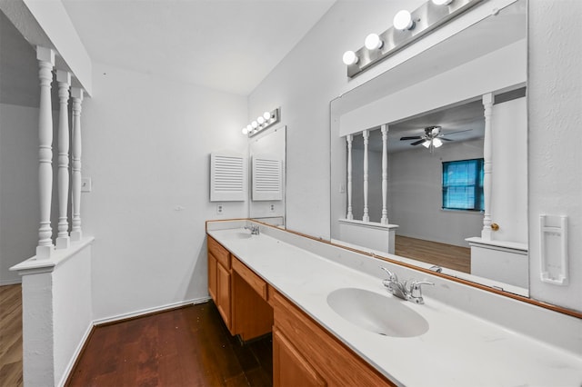 bathroom featuring wood-type flooring, vanity, and ceiling fan