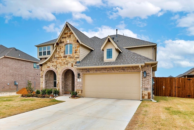 view of front of house featuring a garage and a front yard