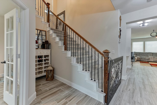 stairs featuring hardwood / wood-style flooring